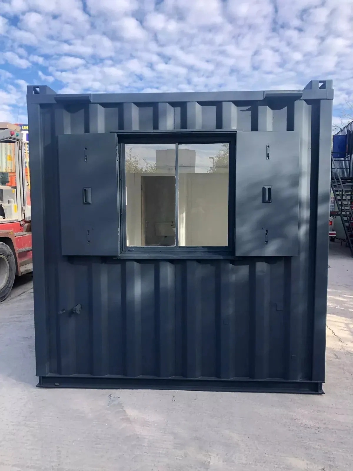 20ft Refurbished Office Container – Kitchenette & Security Shutters – container end wall with window and open security shutters