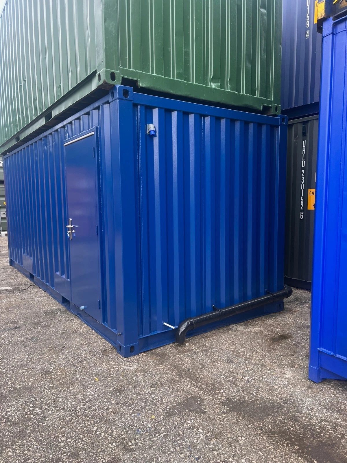 20ft Refurbished Container Toilet Block – Separate Compartments – blue toilet block with side entrance and external drainage pipe