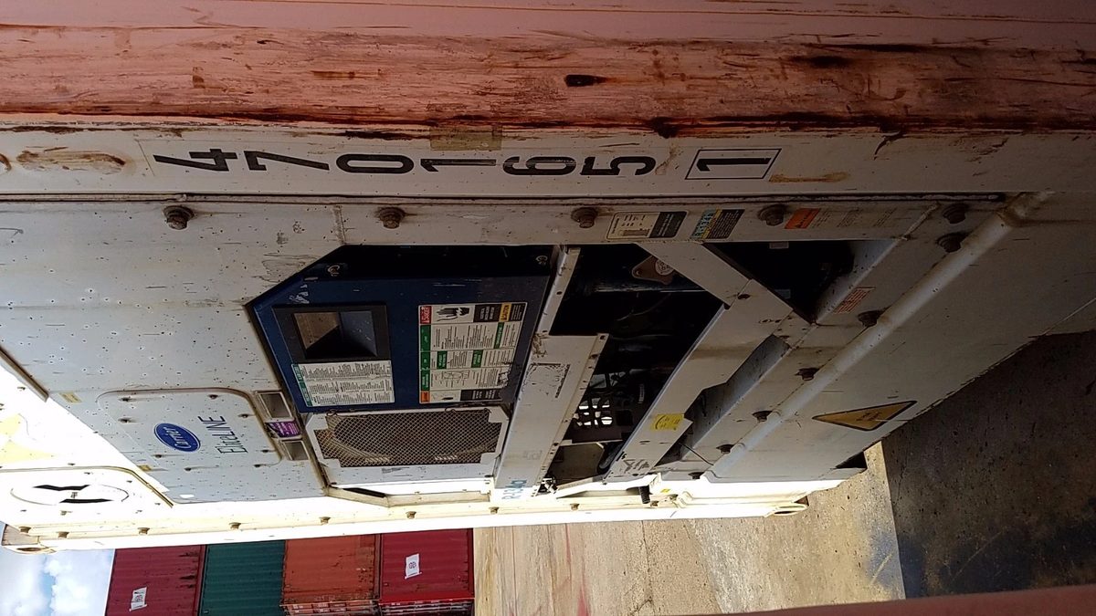 40ft High Cube Reefer Container – Operational Refrigeration – close view of weathered refrigeration machinery on container end