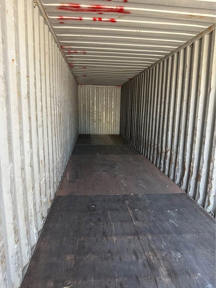 40ft High Cube Shipping Container – Used, Double Rear Doors – empty container interior with worn wooden floor and corrugated walls
