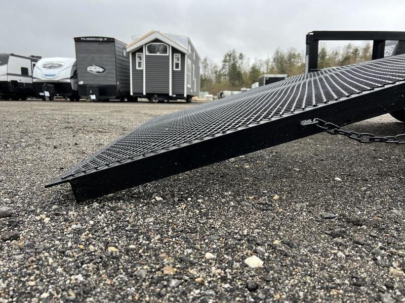 2024 Reiser Trailers 12 ft Landscape Trailer – Ramp Gate – Close-up angle of the mesh ramp gate edge touching the gravel ground