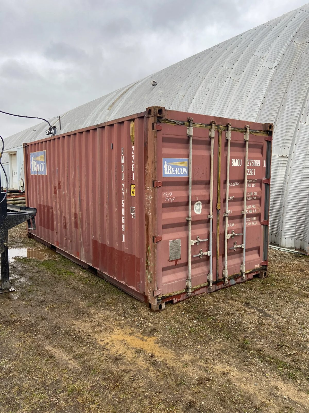 20ft Used Shipping Container – Double Cargo Doors – three-quarter exterior view of weathered container with closed cargo doors
