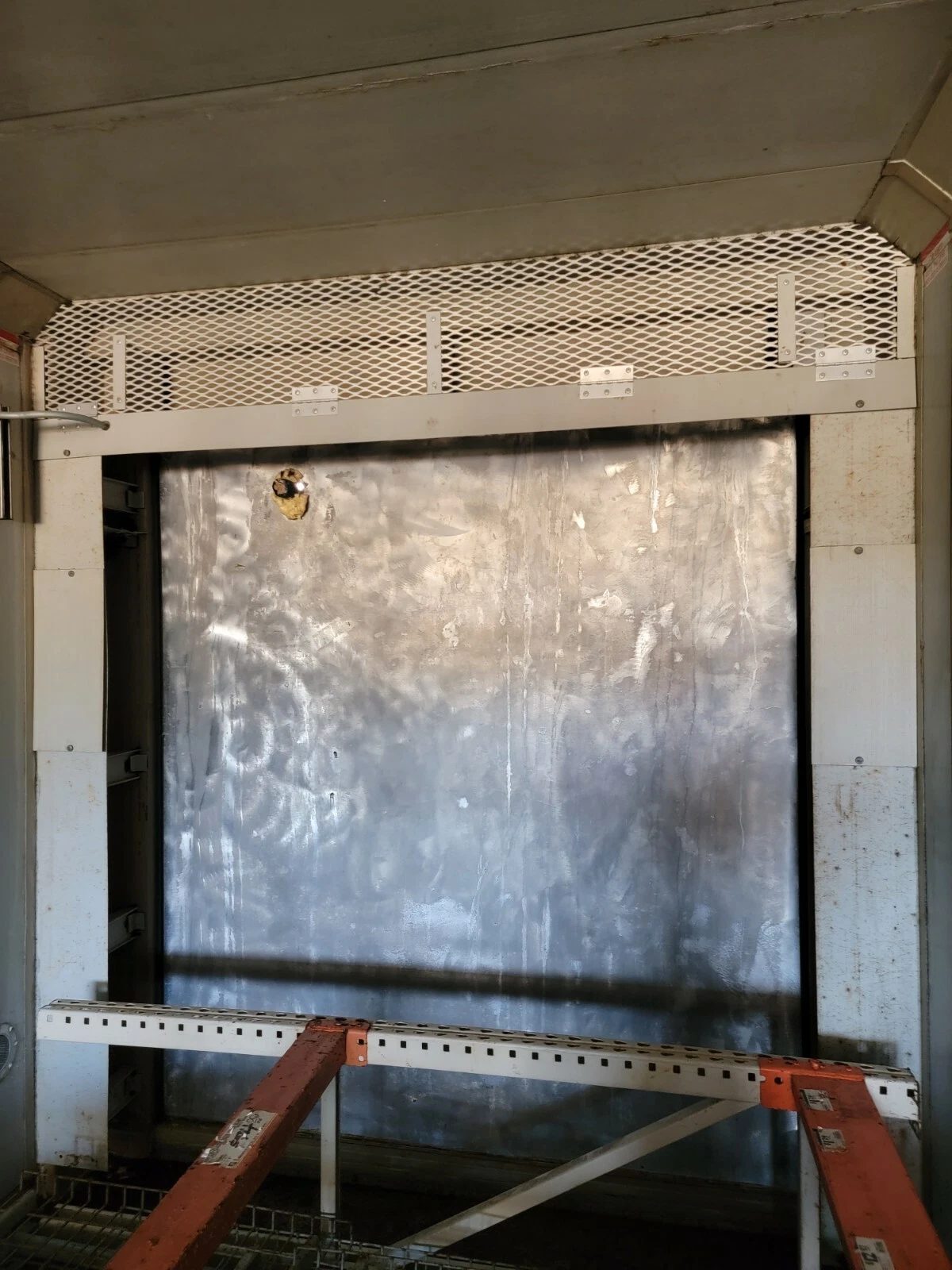 40ft As-Is Insulated Container – Electrical Connection – interior metal bulkhead with overhead mesh and support braces