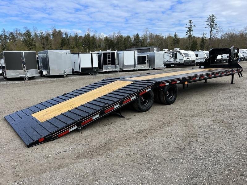 2024 Diamond C 35 ft Equipment Trailer – Auto Dovetail – Rear three-quarter view of the trailer with the loading ramp down