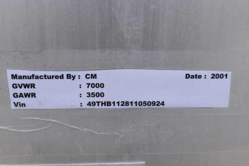 2001 CM Odyssey 2 Horse Trailer – Aluminum Floor – Close-up of the manufacturer identification plate showing the VIN and weight ratings