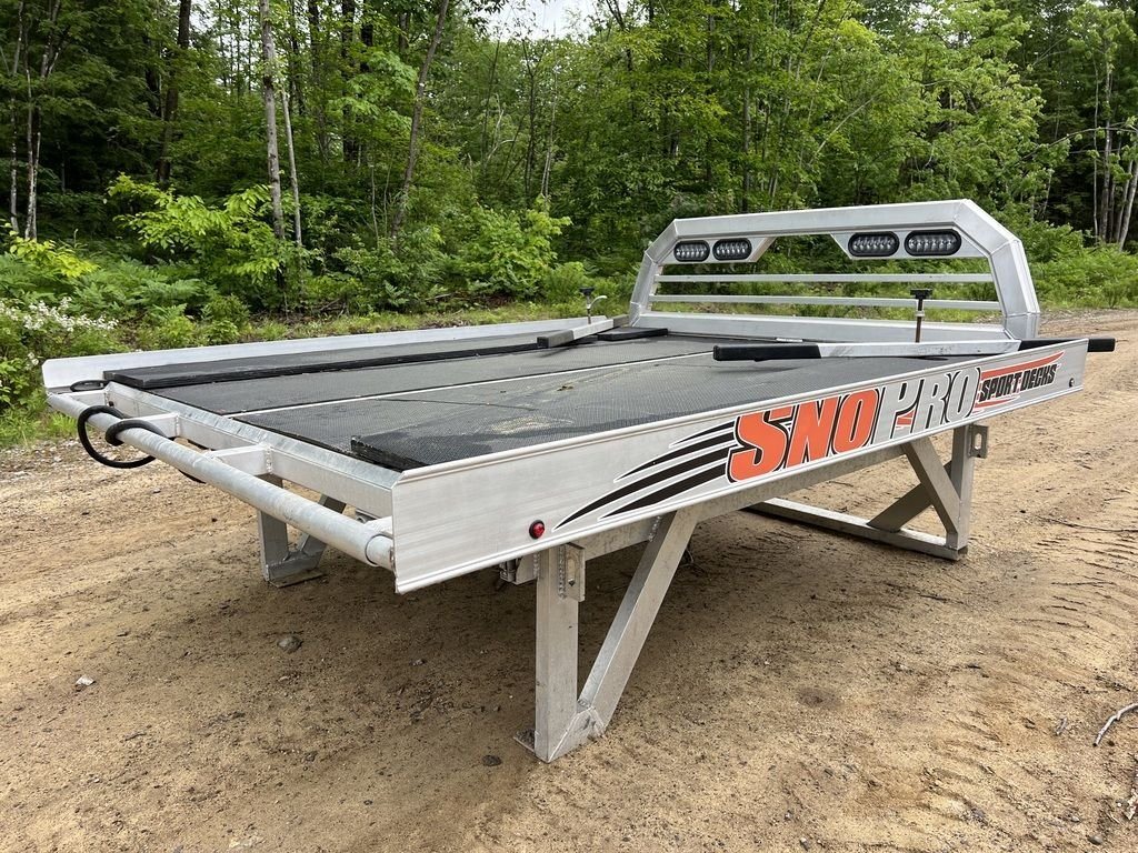 2022 Sno Pro 7 ft Sled Deck – Quad Ply Decking – Rear three quarter view of a silver aluminum sled deck with black surface