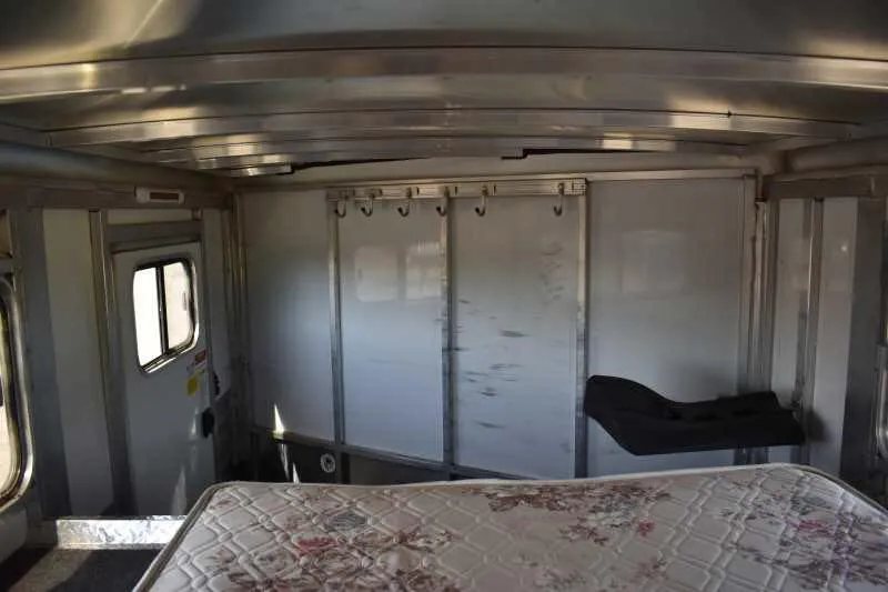2014 Sundowner 2 Horse Gooseneck Trailer – Electric Jack – Interior view of the tack room showing saddle racks and hooks