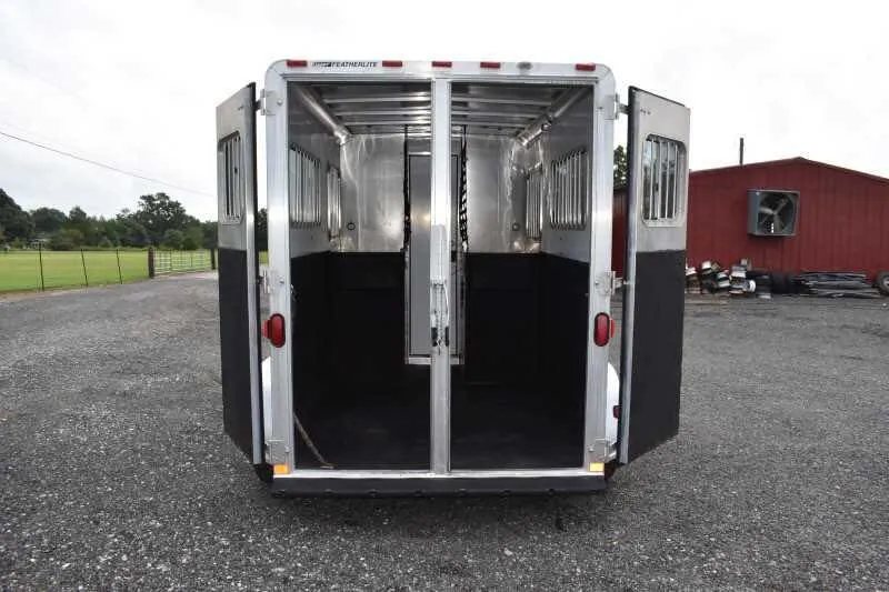 2003 Featherlite 2HST 2 Horse Trailer – Aluminum – Rear view with double doors fully open showing the horse stall area