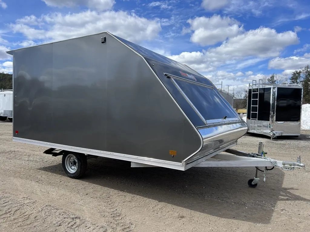 2023 Sno Pro 2-Place Snowmobile Trailer – Galvanized Package – Opposite side exterior view of the grey sloped-front trailer