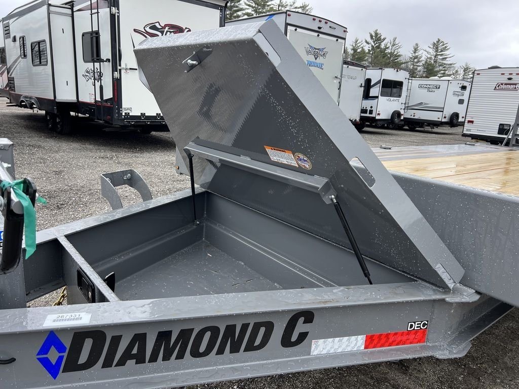 2024 Diamond C Deckover Equipment Trailer – Cement Gray – Open view of the integrated metal tongue box with lid propped open