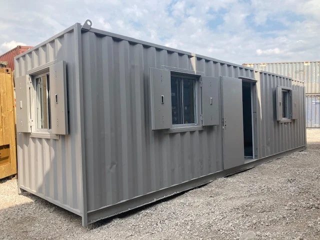 30ft Used Container Office – Insulated, Three Windows – three-quarter exterior of container office with shutters and open door