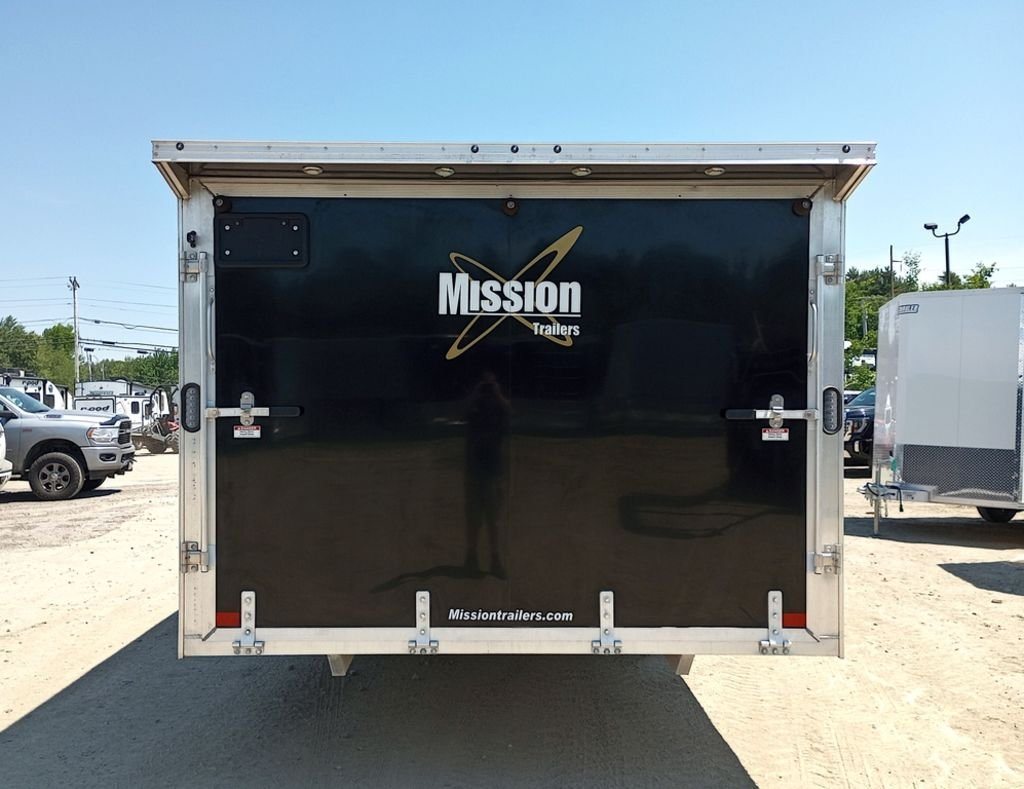 Mission Trailers 22 ft Snowmobile Trailer – 4-Place – Straight-on rear view of the closed ramp door with manufacturer decals
