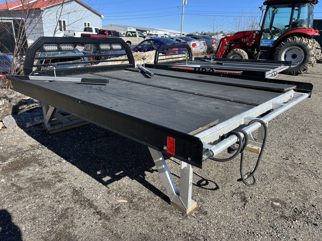 2023 Sno Pro 8 ft Sled Deck – Sliding Sides – Rear corner view showing the black powder coated finish and frame