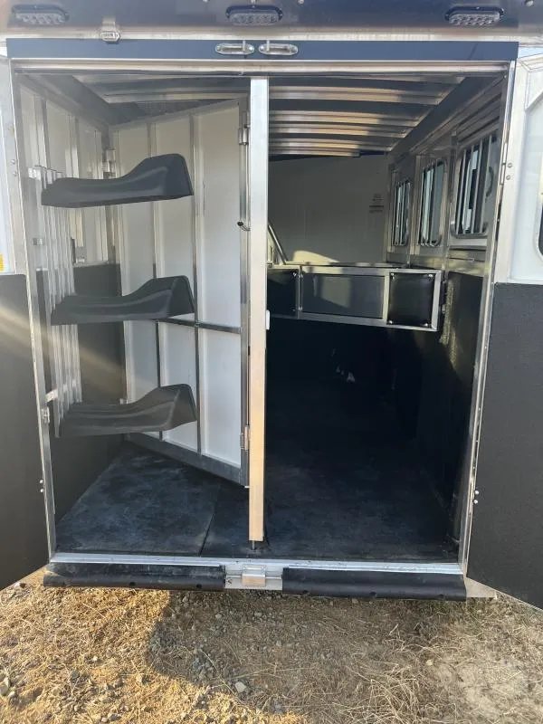 2022 Sundowner 3 Horse Gooseneck – Slant Load – View through the rear doors showing the horse stalls and saddle racks