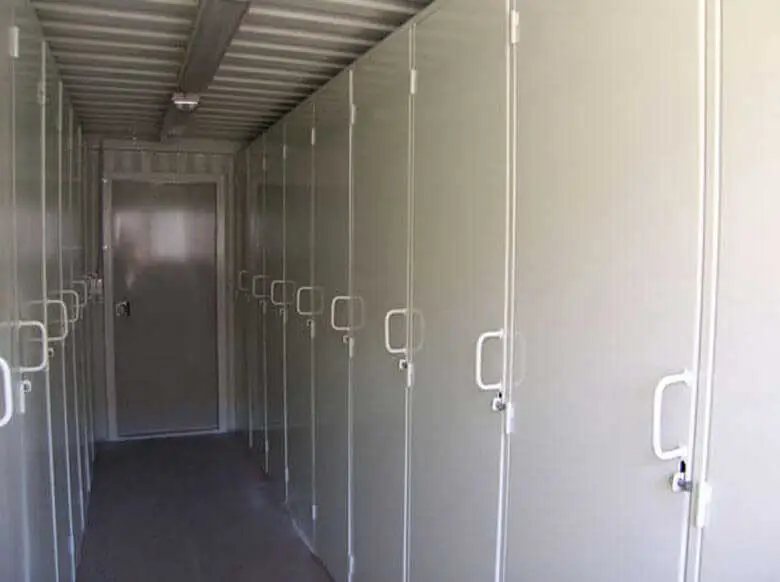 20 ft Container Change Room – Gray – Longitudinal interior view showing a line of lockers and a door at the end