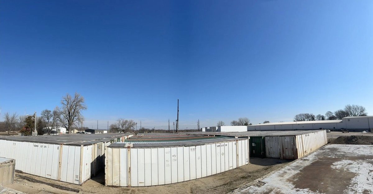 53ft High Cube Shipping Container – Aluminum Construction – elevated view of multiple white containers in storage yard