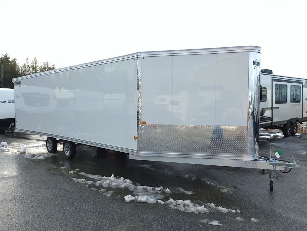 2024 Mission Trailers 24 ft Deckover – Galvanized Package – Clean three-quarter profile of a white deckover enclosed trailer with chrome front