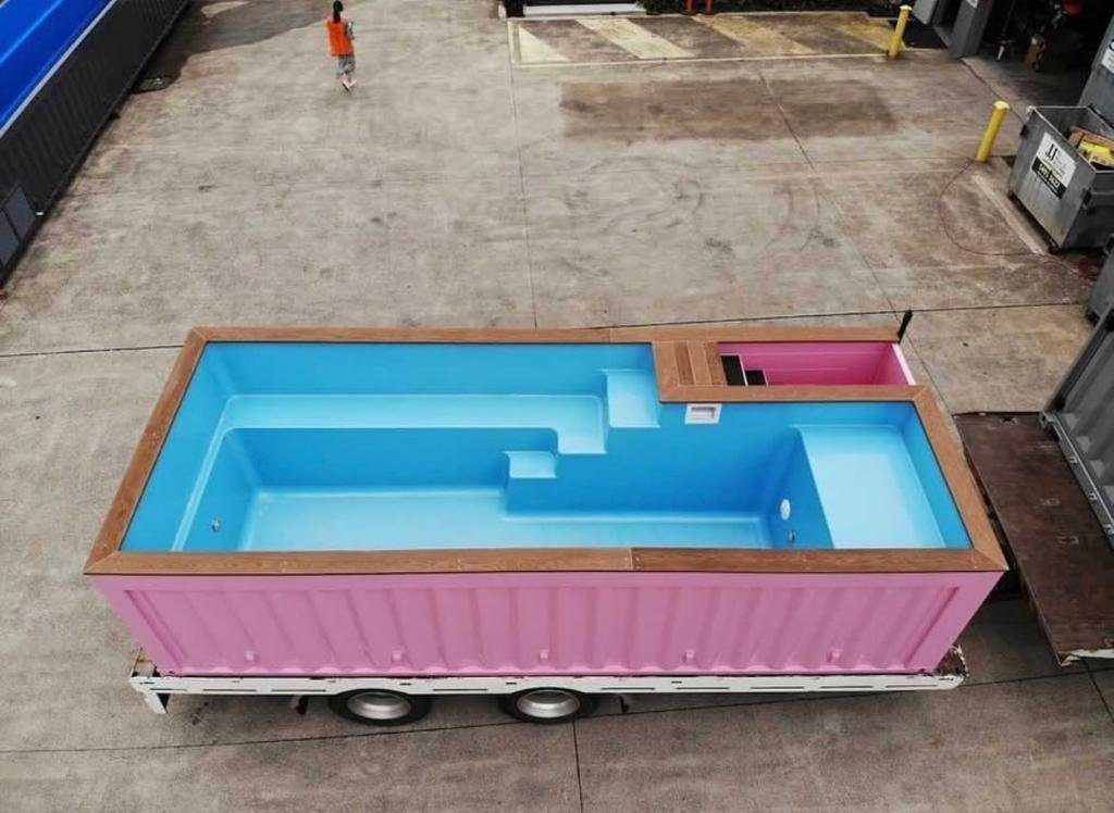 20ft Pink Shipping Container Pool – Built-In Entry Steps – elevated view of pink container pool with blue interior