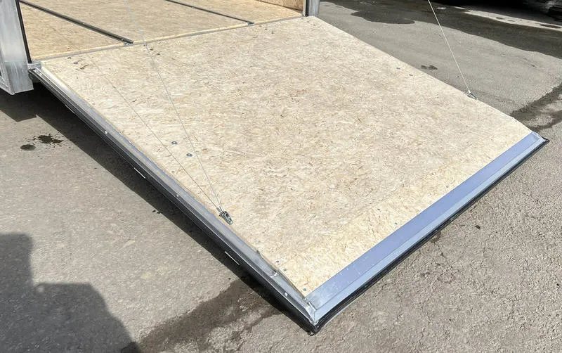 2023 High Country 14 ft Trailer – Blue, Drive-Through – Detail of the rear ramp door surface and the metal transition plate