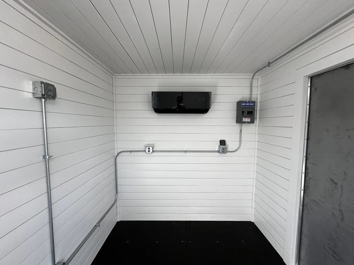 20ft Prefabricated Metal Office – Slate Gray Shiplap – Empty white shiplap interior with air conditioner and exposed conduit