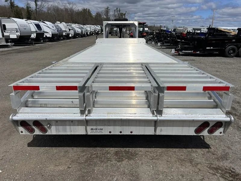 2024 Alum-Line 24 ft Gooseneck – Flip-Over Ramps – Direct rear view of the trailer with ramps folded in the up position