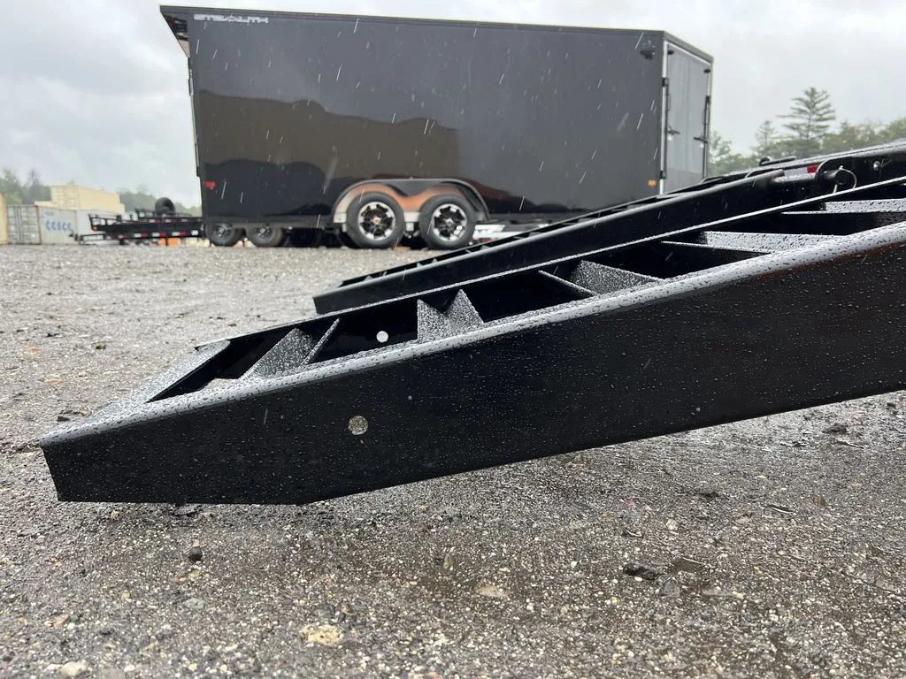 2024 Rice Trailers 16 ft Equipment Trailer – Toolbox – Close-up side view of the metal ladder ramp assembly in a lowered position