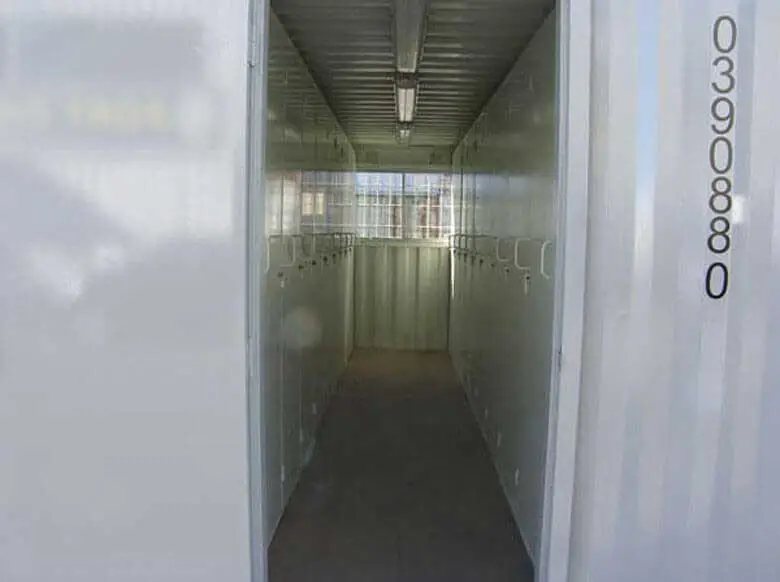 20 ft Container Change Room – Gray – View looking through the open doorway into the interior locker room area