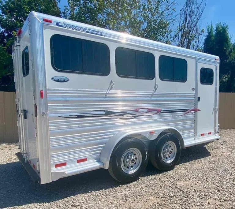 2011 Cimarron 3 Horse Bumper Pull – Insulated Roof – Rear three-quarter view showing the back doors and side windows