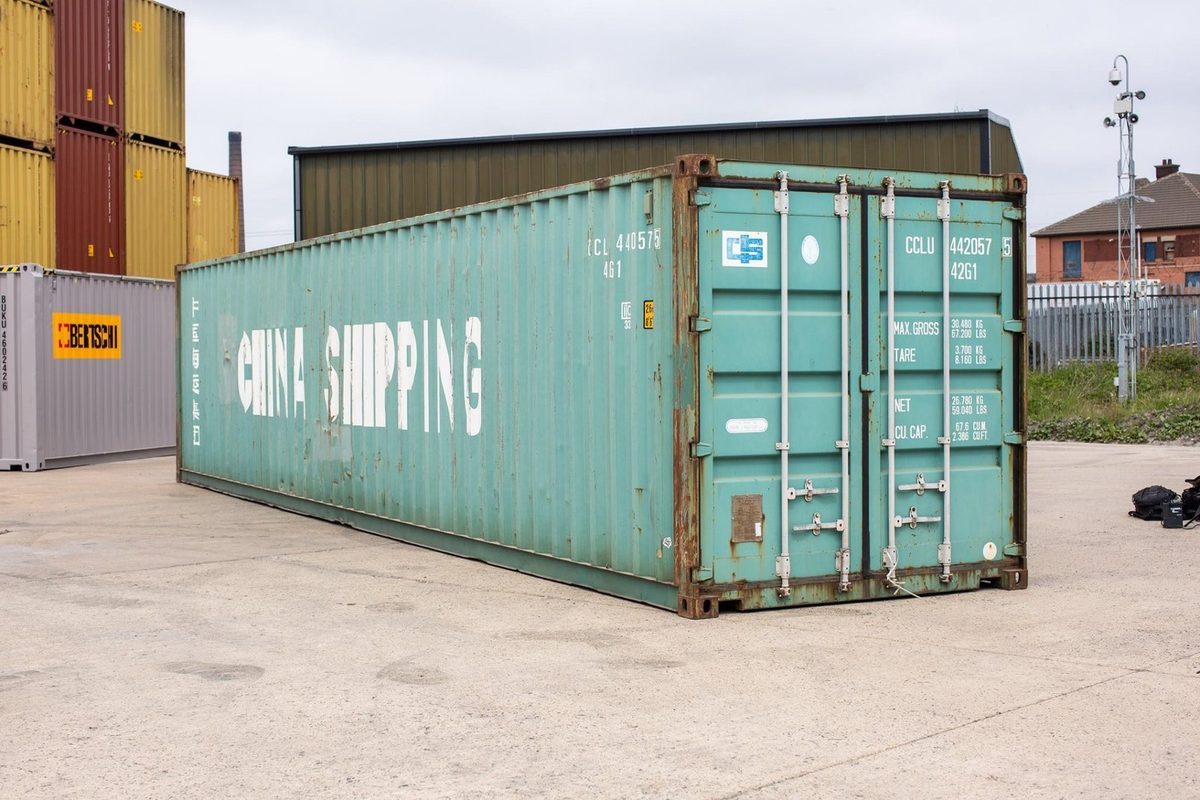 40ft Used Shipping Container – Wind & Watertight Storage – three-quarter exterior view of weathered container with cargo doors closed (2)