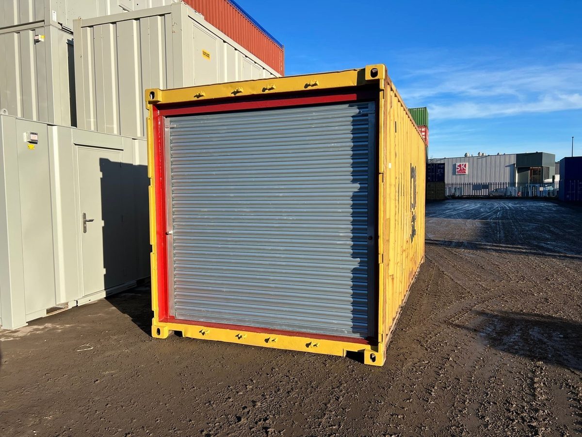 20ft Used Shipping Container – Roller Shutter Door – three-quarter exterior of yellow container with closed roller shutter
