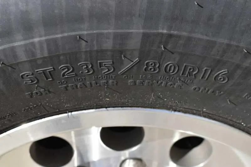 2018 Lakota 4 Horse Trailer – 2 ft Short Wall – Close up of a tire sidewall showing the ST235/80R16 tire size