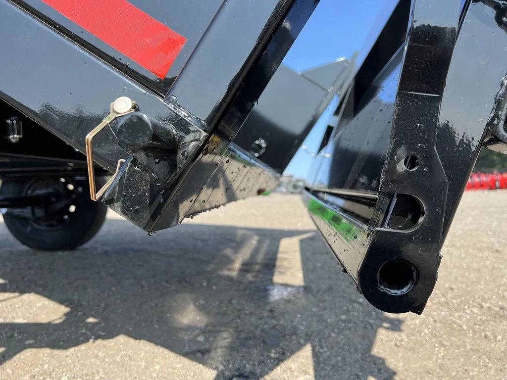 2024 Griffin Trailers 16 ft Dump Trailer – Telescopic – A close-up of the pivot point and pins for the dump bed
