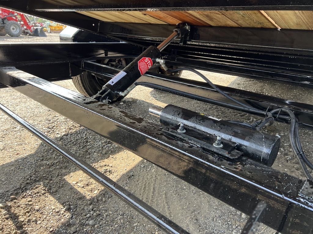 2024 Rice Trailers 20 ft Tilt Deck – Spare Mount – View of the hydraulic tilt cylinder mechanism under the trailer deck
