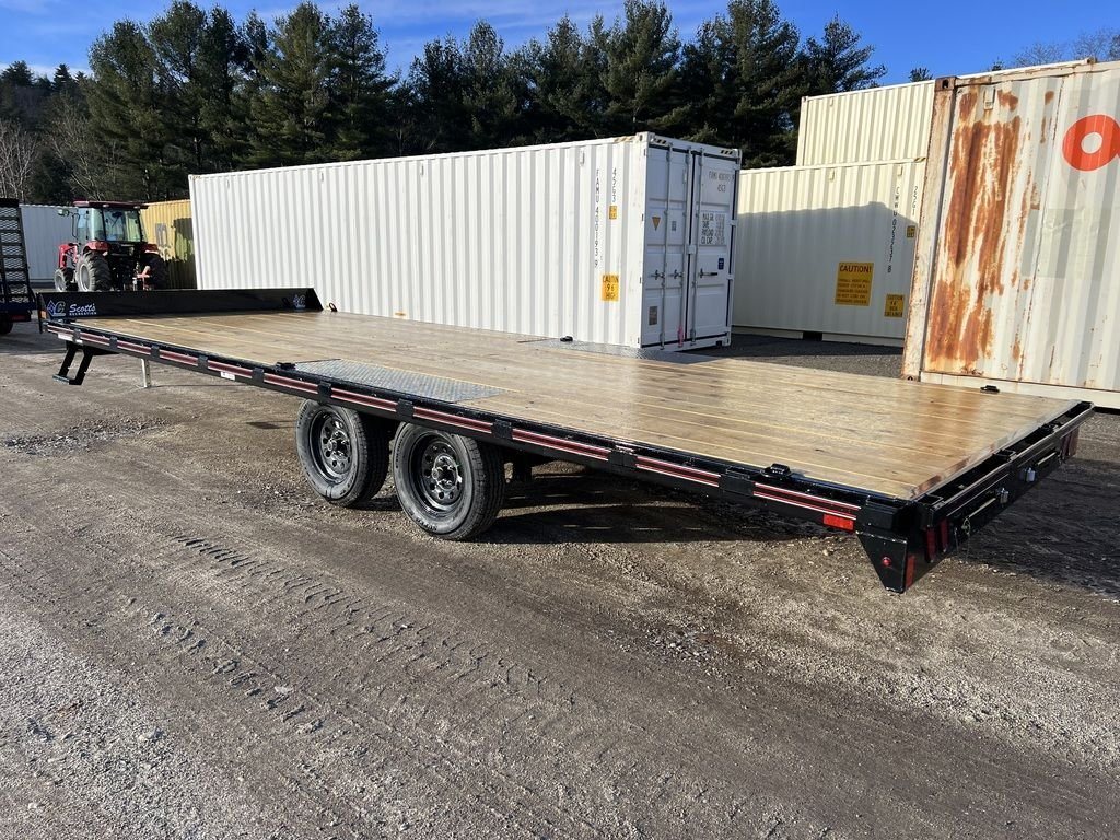 2024 Diamond C 22 ft Deckover Trailer – Slide-In Ramps – Rear three-quarter exterior view of a black deckover trailer with wood flooring