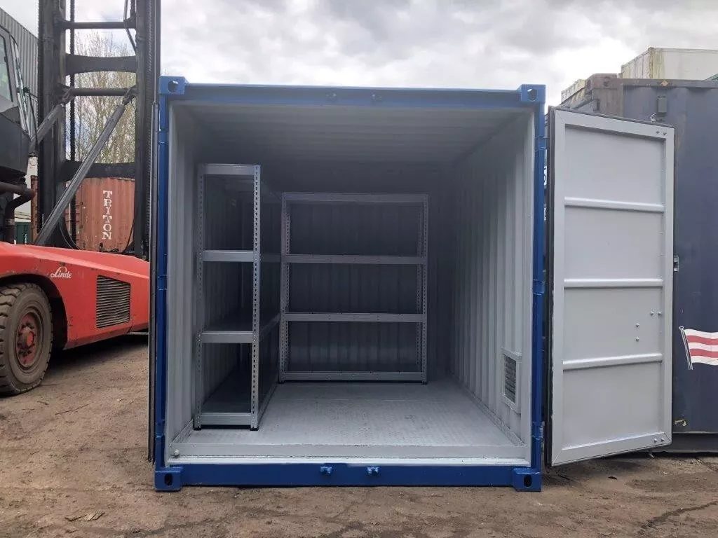 10ft Bunded Shipping Container – Integrated Spill Containment – open container entrance showing metal shelving and bunded floor