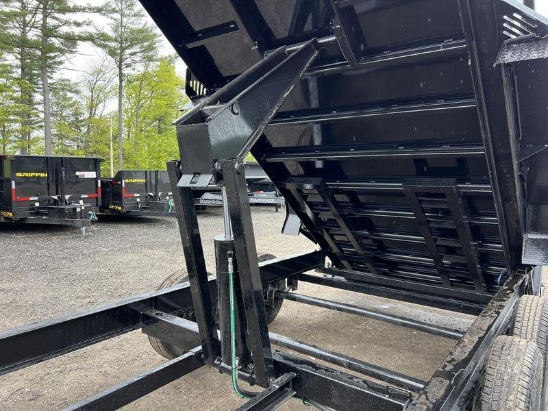 2024 RawMaxx 16 ft Dump Trailer – Tarp Kit – Close-up of the hydraulic lift cylinder underneath the raised bed