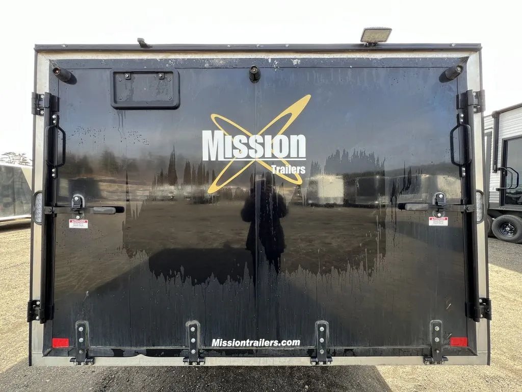 2021 Mission Trailers 2-Place Hybrid – Blackout Package – Closed rear ramp door with company branding and locking mechanisms
