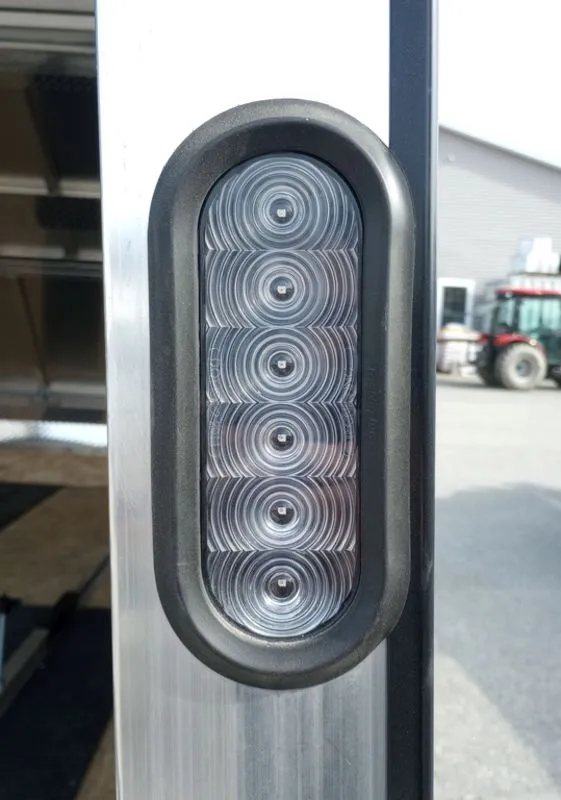 Mission Trailers Aluminum Crossover – Rear Canopy – Close-up of an oval LED tail light mounted on the trailer frame