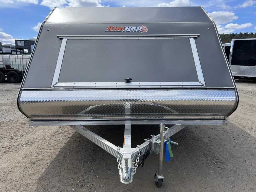 2023 Sno Pro 2-Place Snowmobile Trailer – Galvanized Package – Front view of the trailer showing the large access hatch and diamond plate guard