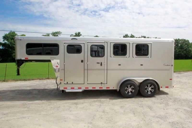 2016 Sundowner 3 Horse Gooseneck – Aluminum, Dressing Room – Clean side view of a silver gooseneck horse trailer showing closed doors and windows