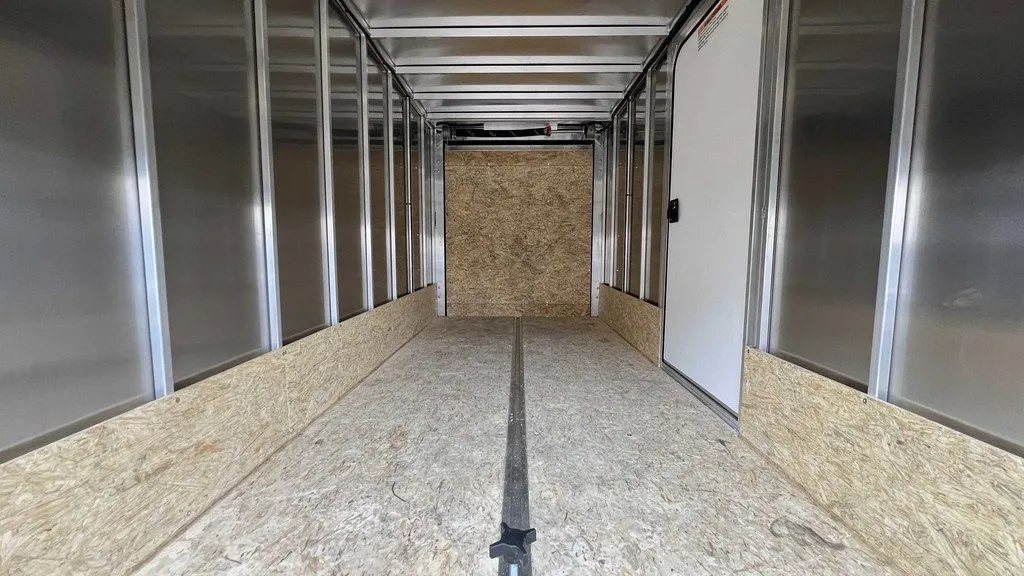 2024 Mission Trailers Crossover Trailer – Galvanized Package – Interior view looking towards the rear with wood flooring and walls