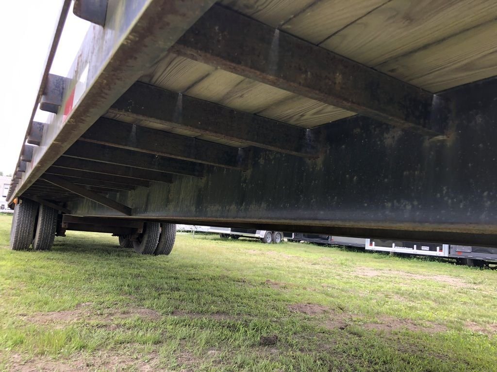 2002 Kaufman 40 ft Equipment Trailer – Toolbox – Underside view showing wooden floor planks and black metal cross members