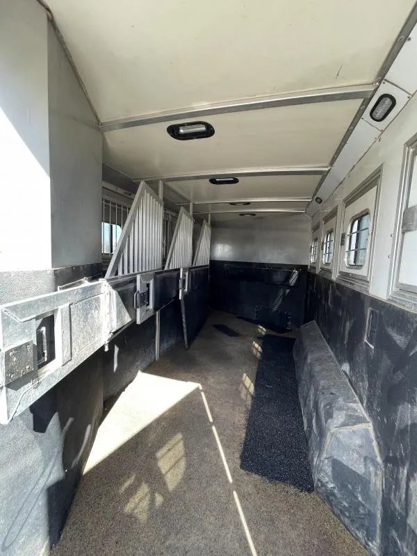 2016 Hart Ultimate 4 Horse Trailer – Champagne, Hay Pod – Interior view of the horse stall area with padded dividers and rubber mats