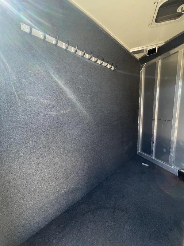2016 Hart Ultimate 4 Horse Trailer – Champagne, Hay Pod – Internal view of the dressing room area with carpeted walls and bridle hooks