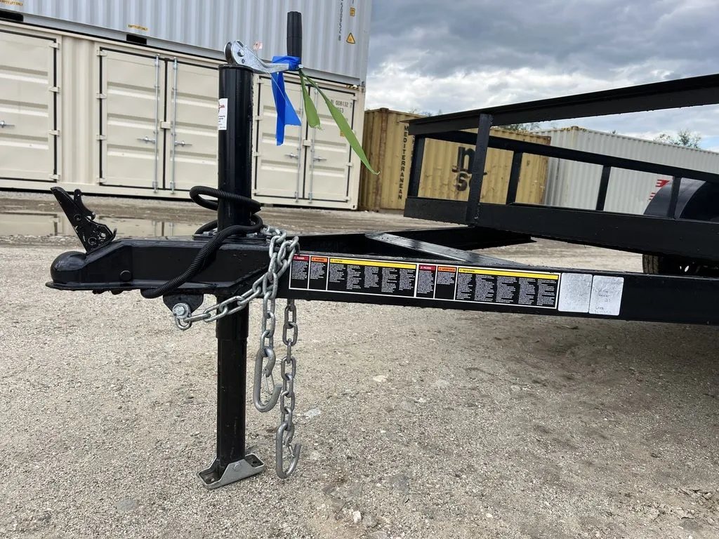 2024 Carry-On 12 ft Utility Trailer – Rear Ramp Gate – Close-up view of the trailer coupler, safety chains, and manual jack