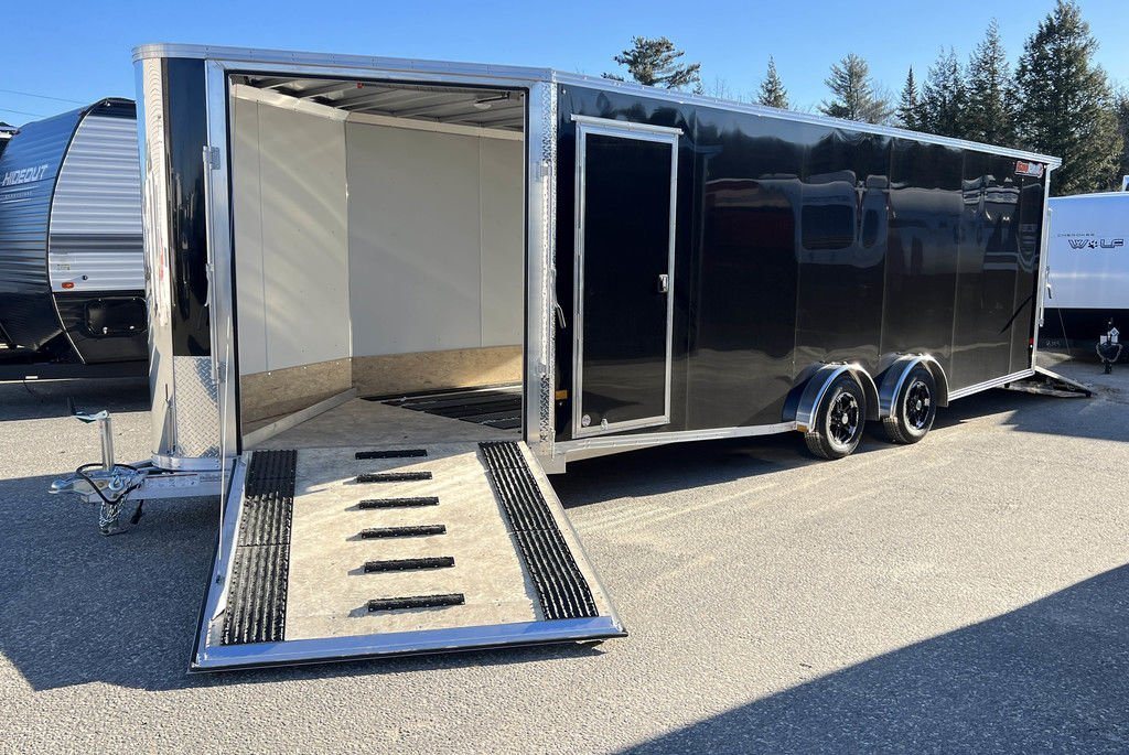 2024 Sno Pro 22 ft Snowmobile Trailer – Extra Height – Front side ramp door open showing the interior floor and guide tracks