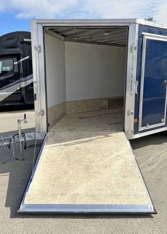 2023 High Country 14 ft Trailer – Blue, Drive-Through – A straight-on view of the open front ramp door leading into the trailer