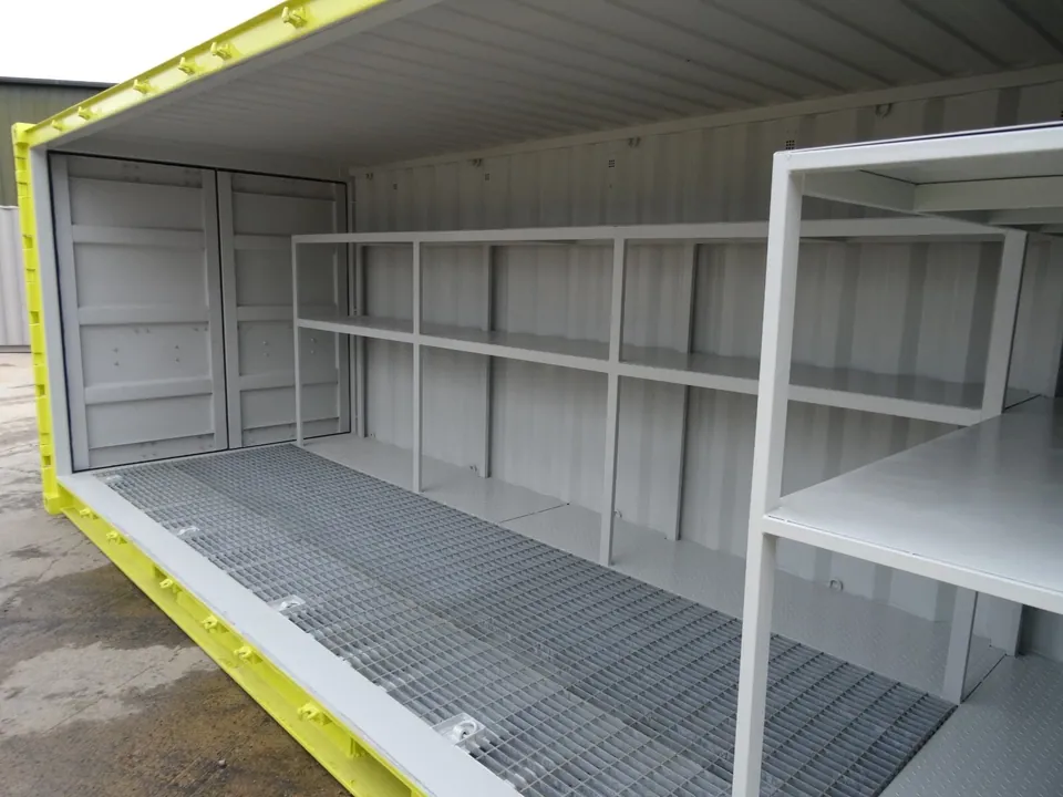 20ft Bunded Storage Container – Integrated Spill Containment – Storage container interior with metal shelving and grated floor