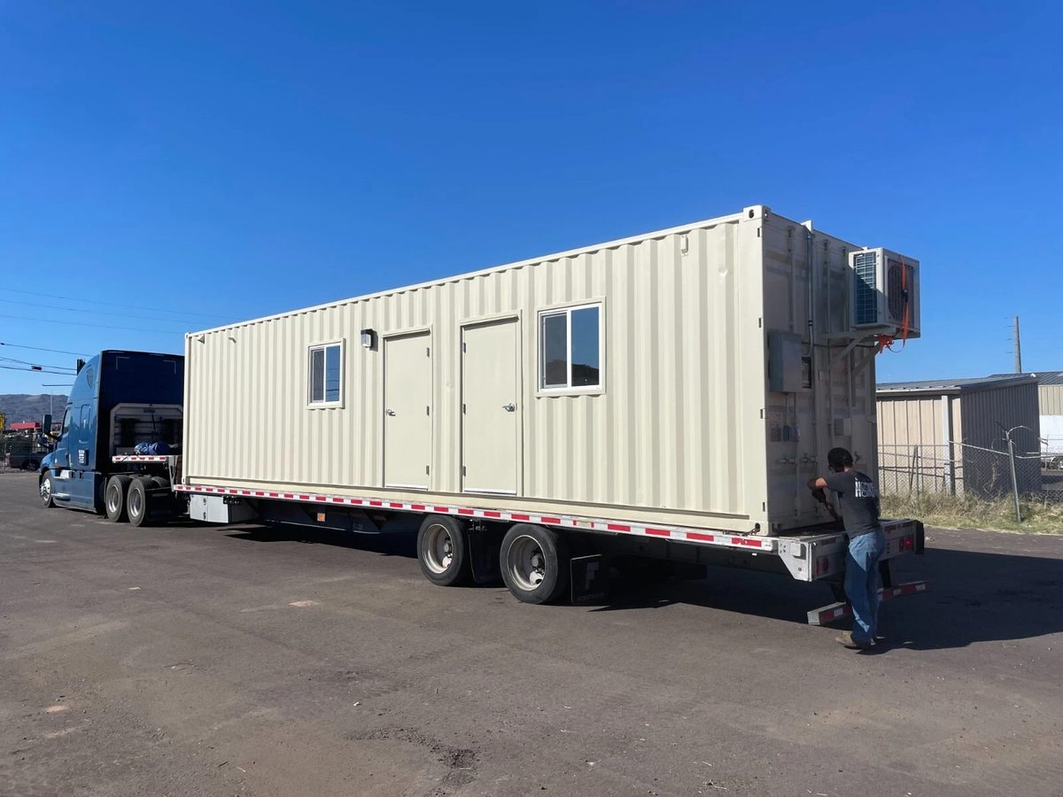40ft Converted Container Office – Accessible Restroom – cream container office on flatbed with two doors and windows