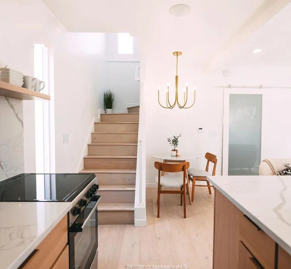 3-Bedroom Duplex Container Home – Rooftop Deck – Internal timber stair connects the open living level to the two upper bedrooms